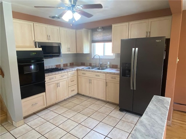 501 Kingsley Ave, Brentwood, PA 15227 - kitchen with black appliances, a sink, tile counters, a warming drawer, and a ceiling fan