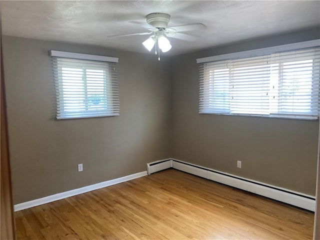 501 Kingsley Ave, Brentwood, PA 15227 - spare room featuring ceiling fan, light wood-style floors, baseboards, and baseboard heating