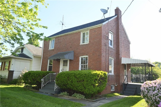 2310 Delaware Ave, New Castle/2Nd, PA 16105 - view of front of property featuring a front lawn and brick siding