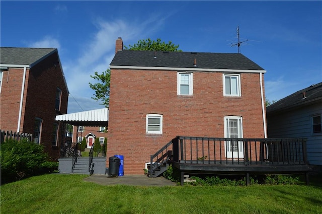 2310 Delaware Ave, New Castle/2Nd, PA 16105 - rear view of house featuring a chimney, brick siding, a lawn, and a deck