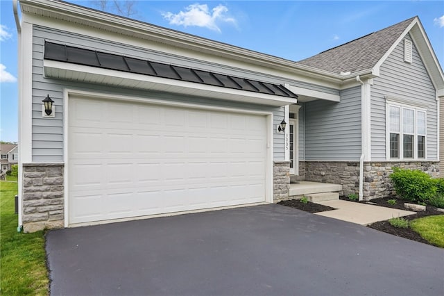 3005 Sir Charles Dr, Cecil, PA 15057 - view of front of property with stone siding, driveway, roof with shingles, and a garage