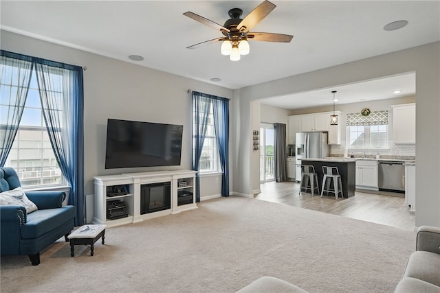 3005 Sir Charles Dr, Cecil, PA 15057 - living room featuring ceiling fan, light colored carpet, and baseboards