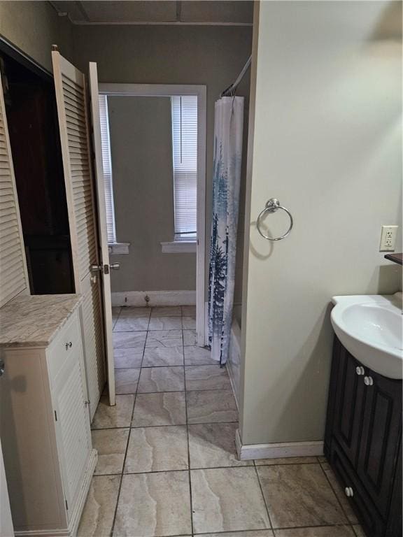 619 Dawson St, Wall Boro, PA 15148 - bathroom with marble finish floors, baseboards, vanity, and shower / bath combo