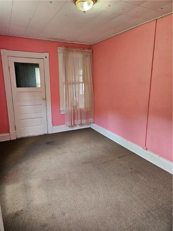 619 Dawson St, Wall Boro, PA 15148 - carpeted spare room with baseboards