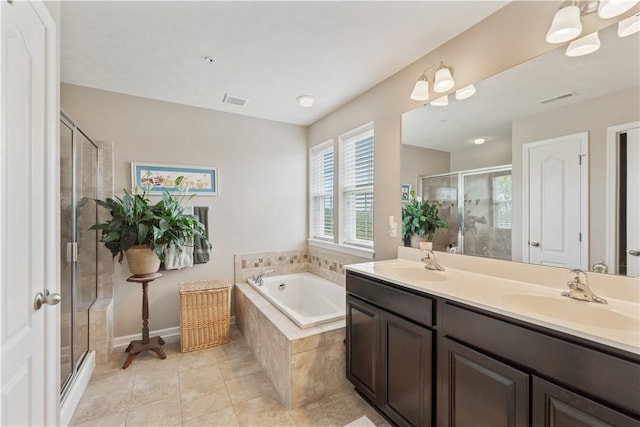 2282 Flint Dr, South Strabane, PA 15301 - bathroom featuring a stall shower, a garden tub, double vanity, and tile patterned flooring