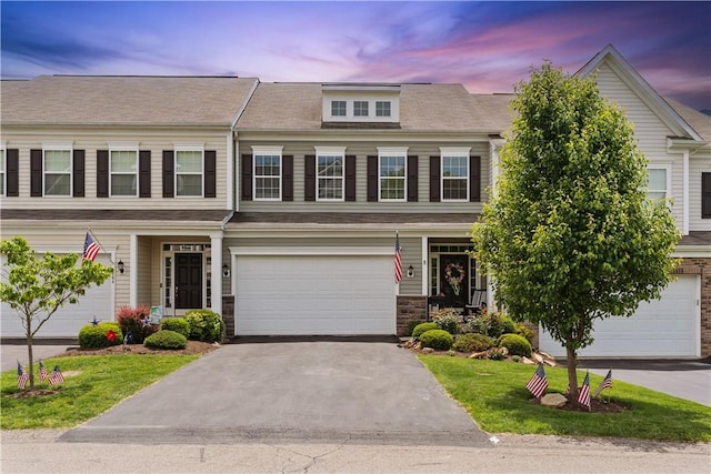 2282 Flint Dr, South Strabane, PA 15301 - view of front of home with an attached garage, asphalt driveway, and stone siding