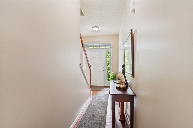 2282 Flint Dr, South Strabane, PA 15301 - doorway to outside featuring baseboards, wood finished floors, and stairs