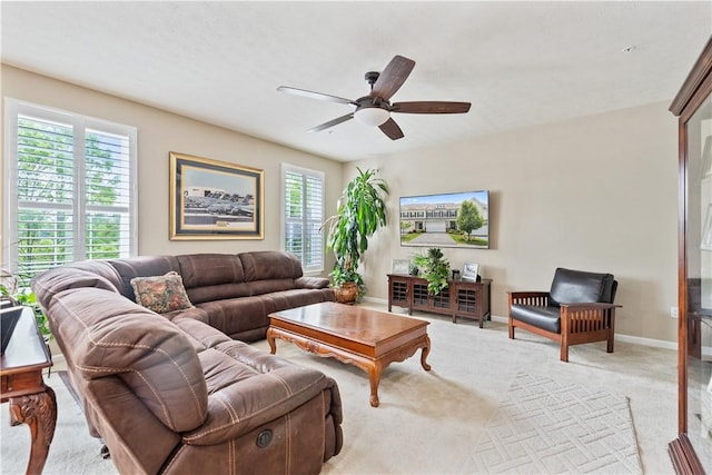 2282 Flint Dr, South Strabane, PA 15301 - living room featuring light carpet, plenty of natural light, a ceiling fan, and baseboards