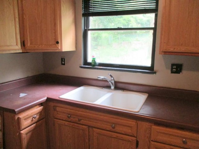 1528 Beaver Rd, Ambridge, PA 15003 - kitchen with a sink, dark countertops, and brown cabinetry