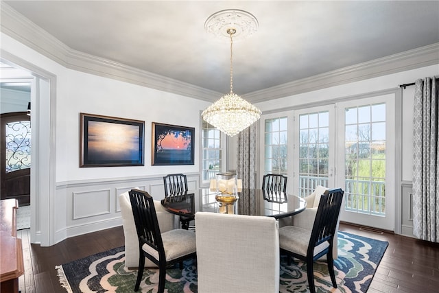 506 Villa Dr, Peters Twp, PA 15367 - dining area featuring dark wood-style floors, a chandelier, healthy amount of natural light, a decorative wall, and wainscoting