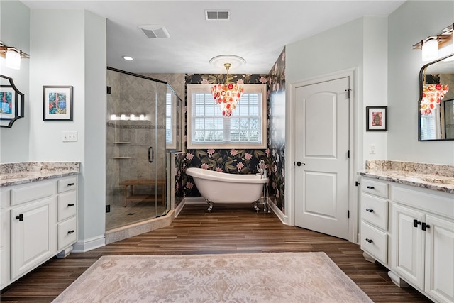506 Villa Dr, Peters Twp, PA 15367 - full bath featuring a stall shower, vanity, wood finished floors, a freestanding bath, and recessed lighting