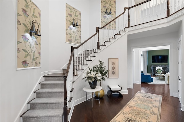 506 Villa Dr, Peters Twp, PA 15367 - staircase featuring wood finished floors, baseboards, and a high ceiling