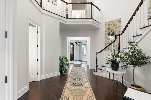 506 Villa Dr, Peters Twp, PA 15367 - entryway featuring stairs, baseboards, wood-type flooring, a high ceiling, and a chandelier