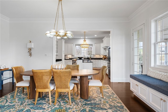 506 Villa Dr, Peters Twp, PA 15367 - dining room featuring crown molding, dark wood-style flooring, baseboards, and a chandelier
