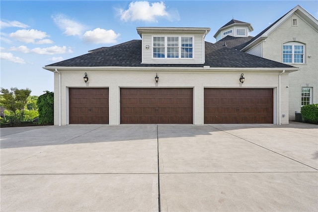 506 Villa Dr, Peters Twp, PA 15367 - view of side of home featuring concrete driveway, a garage, and roof with shingles