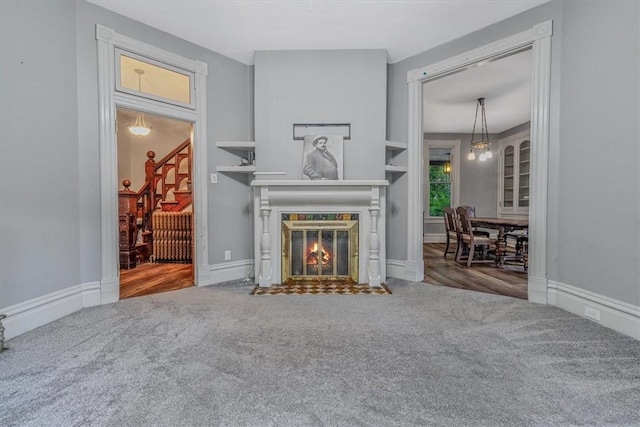 5 Rio Vista St, West Newton, PA 15089 - carpeted living room with a fireplace with flush hearth and stairs