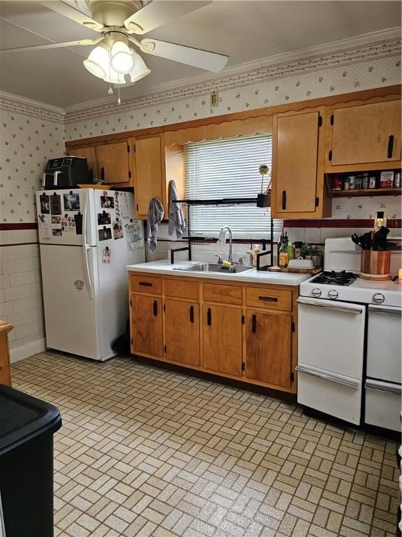 2318 Cottage Ave, Natrona Hts/Harrison Twp, PA 15065 - kitchen with wallpapered walls, white appliances, a sink, light countertops, and brick patterned floors