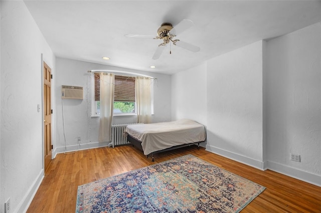 3983 Beechwood Blvd, Squirrel Hill, PA 15217 - bedroom featuring radiator, wood finished floors, an AC wall unit, baseboards, and recessed lighting