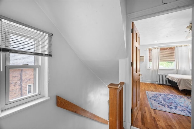 3983 Beechwood Blvd, Squirrel Hill, PA 15217 - bedroom featuring radiator heating unit, wood finished floors, and vaulted ceiling