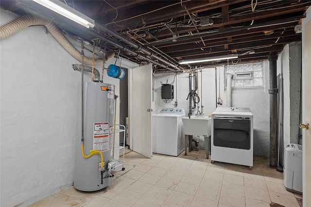 3983 Beechwood Blvd, Squirrel Hill, PA 15217 - basement featuring washing machine and clothes dryer, gas water heater, and a sink
