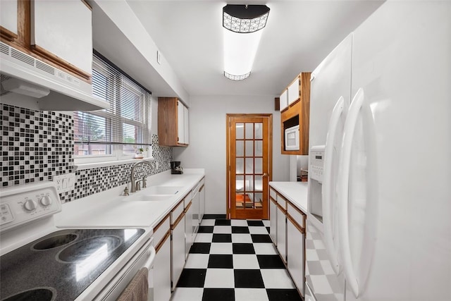 3983 Beechwood Blvd, Squirrel Hill, PA 15217 - kitchen with white appliances, a sink, dark flooring, light countertops, and under cabinet range hood