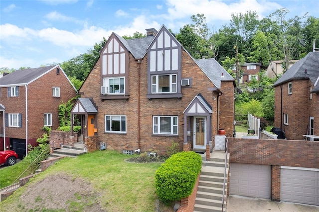 3983 Beechwood Blvd, Squirrel Hill, PA 15217 - english style home with brick siding, a front lawn, a chimney, and roof with shingles