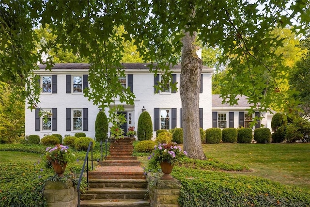 22 Woodland Rd, Edgeworth, PA 15143 - colonial-style house featuring stairway and a front lawn