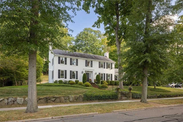 22 Woodland Rd, Edgeworth, PA 15143 - colonial house featuring a chimney and a front yard