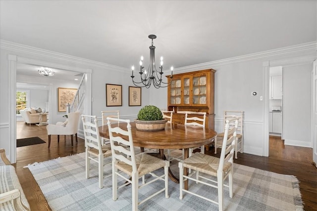 22 Woodland Rd, Edgeworth, PA 15143 - dining area with a chandelier, wood finished floors, and crown molding