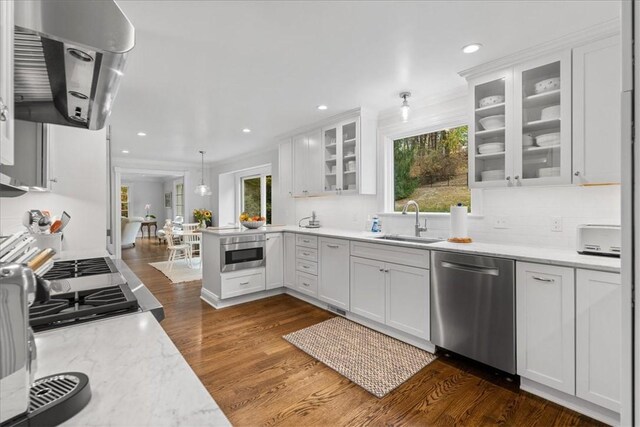 22 Woodland Rd, Edgeworth, PA 15143 - kitchen with dishwasher, a sink, dark wood-type flooring, range hood, and white cabinets