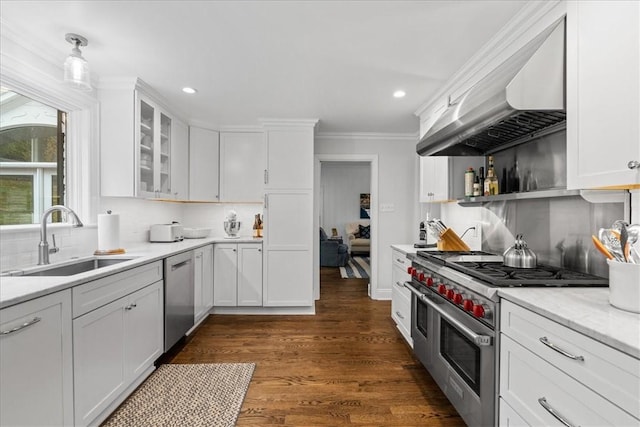 22 Woodland Rd, Edgeworth, PA 15143 - kitchen featuring a sink, appliances with stainless steel finishes, extractor fan, white cabinetry, and tasteful backsplash