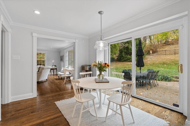 22 Woodland Rd, Edgeworth, PA 15143 - dining area with wood finished floors, crown molding, baseboards, and recessed lighting