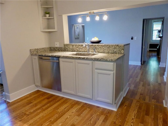 5227 Dearborn St, Garfield, PA 15224 - kitchen with a sink, stainless steel dishwasher, a peninsula, open shelves, and wood finished floors