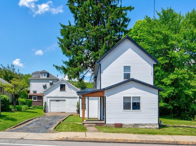 28 Line Ave, Ellwood City Law, PA 16117 - view of front of home with a detached garage, an outbuilding, and a front yard