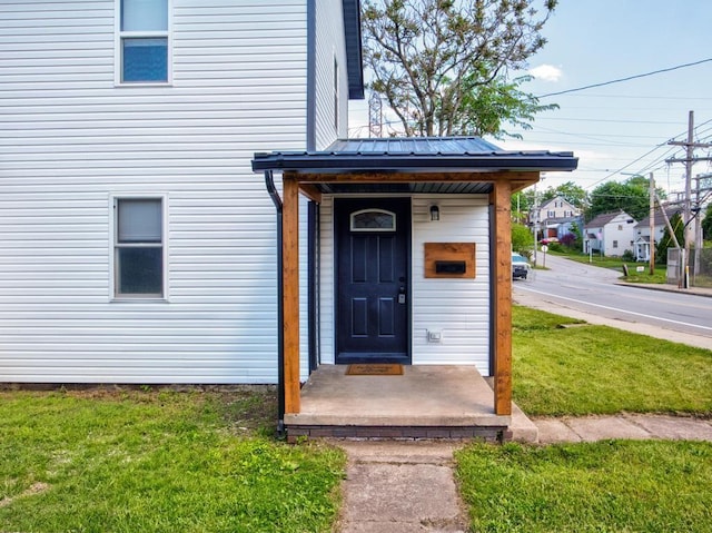 28 Line Ave, Ellwood City Law, PA 16117 - doorway to property with a yard and metal roof