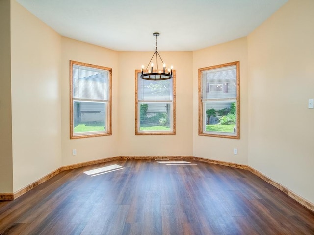 28 Line Ave, Ellwood City Law, PA 16117 - empty room featuring a chandelier, dark wood finished floors, and baseboards