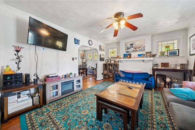 121 N Lehigh St, Munhall, PA 15120 - living room with arched walkways, a ceiling fan, and wood finished floors