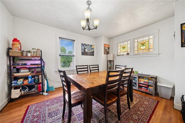 121 N Lehigh St, Munhall, PA 15120 - dining space with a chandelier and wood finished floors