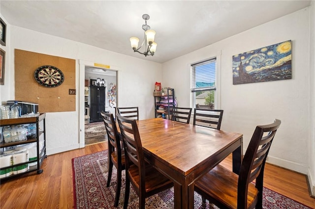 121 N Lehigh St, Munhall, PA 15120 - dining space featuring wood finished floors and a chandelier