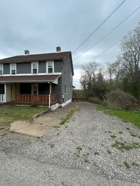 1318 Macarthur Dr, West Deer, PA 15076 - view of front of house with a porch and driveway