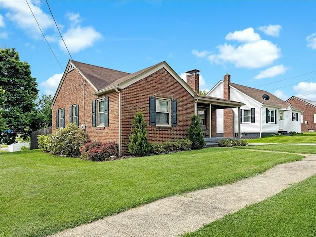 940 Warren Ave, New Castle/4Th, PA 16101 - view of front of home with brick siding, a front yard, and a chimney