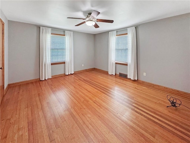 940 Warren Ave, New Castle/4Th, PA 16101 - unfurnished room with healthy amount of natural light, light wood-style floors, a ceiling fan, and baseboards