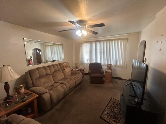 217 Meadow Ave, Charleroi Boro, PA 15022 - carpeted living room featuring a ceiling fan and arched walkways