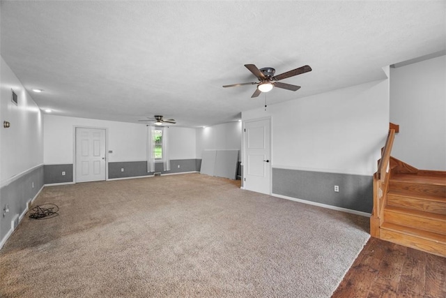 146 Peters Ln, Winfield Twp, PA 16023 - unfurnished living room featuring a ceiling fan, stairs, wood finished floors, and baseboards