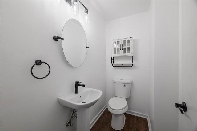 146 Peters Ln, Winfield Twp, PA 16023 - half bathroom featuring wood finished floors, toilet, and baseboards
