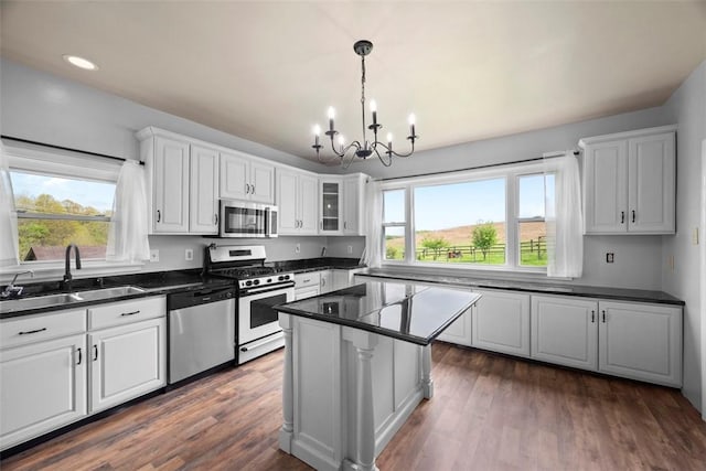 146 Peters Ln, Winfield Twp, PA 16023 - kitchen featuring appliances with stainless steel finishes, a sink, a chandelier, dark countertops, and white cabinets