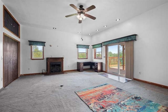 146 Peters Ln, Winfield Twp, PA 16023 - unfurnished living room with carpet floors, healthy amount of natural light, a fireplace, ceiling fan, and recessed lighting