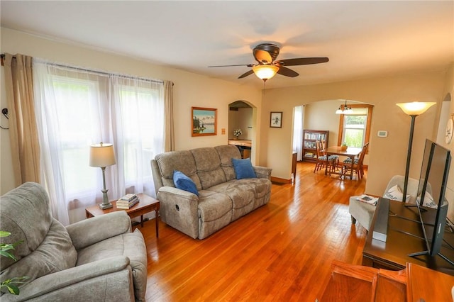 1265 Slippery Rock Rd, Liberty Twp, PA 16057 - living area featuring arched walkways, light wood-style floors, and ceiling fan