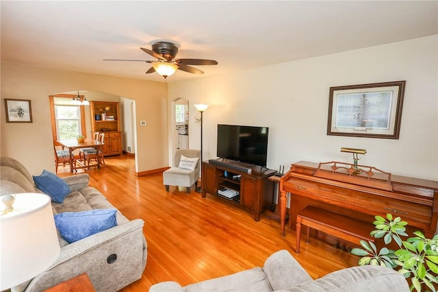 1265 Slippery Rock Rd, Liberty Twp, PA 16057 - living room featuring arched walkways, light wood-type flooring, and a ceiling fan