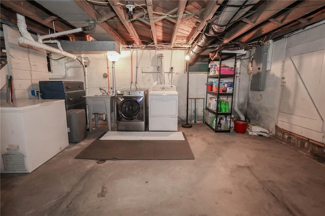 1265 Slippery Rock Rd, Liberty Twp, PA 16057 - unfinished below grade area with independent washer and dryer, electric panel, and a sink